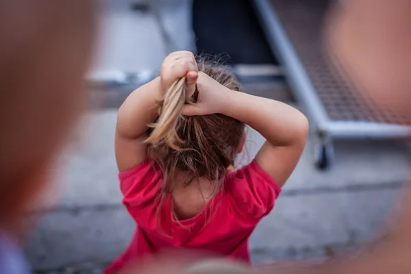 Girl adjusting hair — Stock Photo, Image