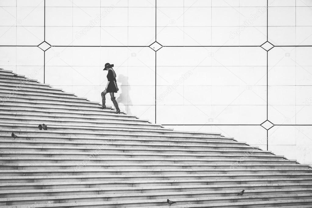 Woman walking up the stairs