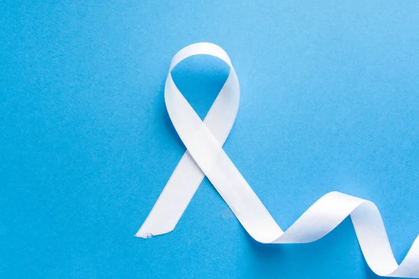 White ribbon as symbol of woman violence — Stock Photo, Image