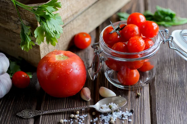 Cherry tomatoes bowl on wooden table — Stock Photo, Image