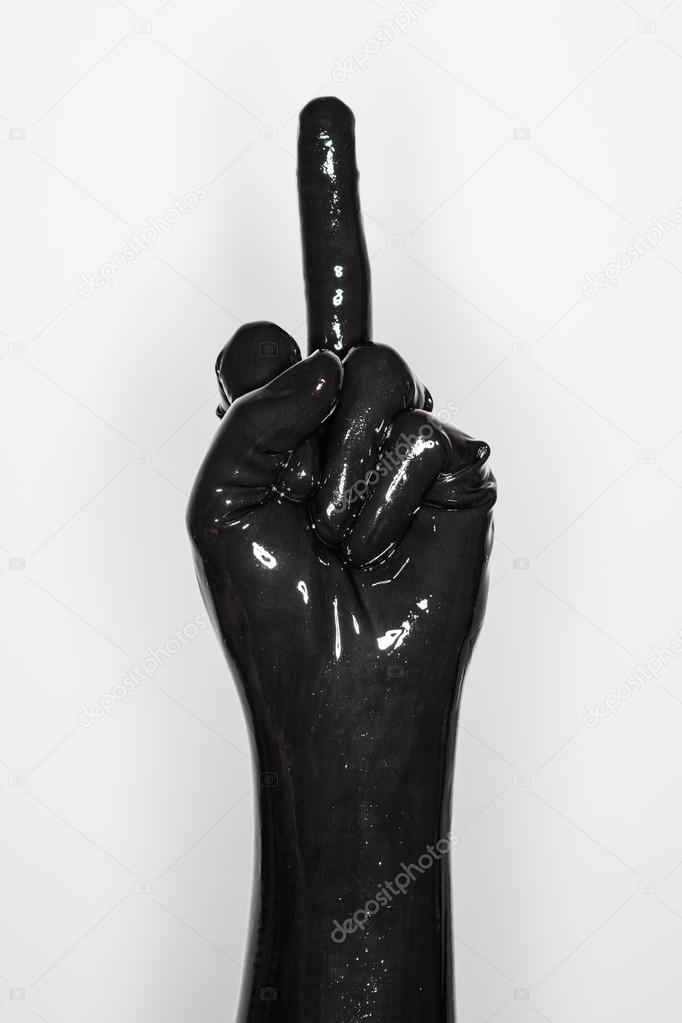 huh Fremragende Manifest Gesture of a hand wearing a black latex glove. middle finger Stock Photo by  ©StockCar 122736048