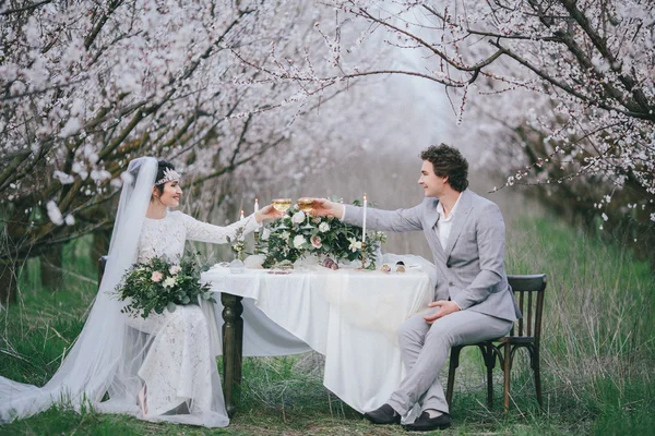 Bride and groom at the holiday table — Stock Photo, Image