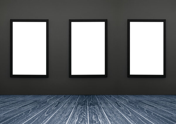 Three Black frame hanging on a grey wall, white isolate, included clipping path in a frame , perspective dark blue wooden floor, for advertiser, graphic editor