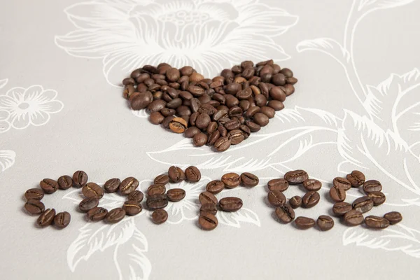 Inscription, faire du café ? Le cœur et l'inscription grains de café — Photo