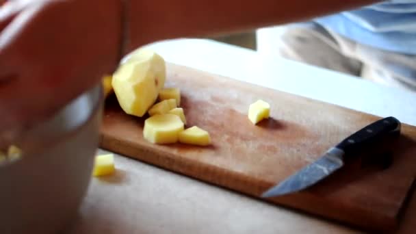 Chef Removes Sliced Potatoes Board Bowl Girl Dices Peeled Potatoes — Stock Video