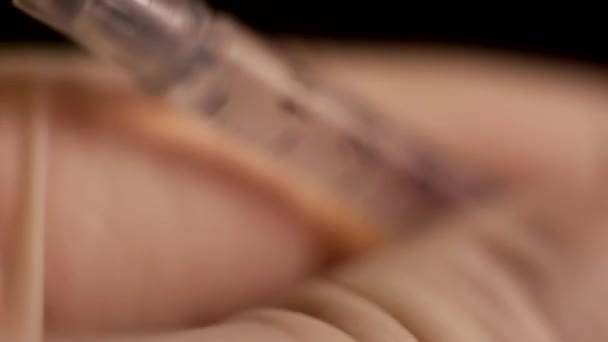 Macro photography of a syringe with the liquid — Stock Video