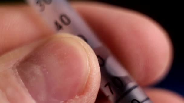 Macro photography of a syringe with the liquid — Stock Video