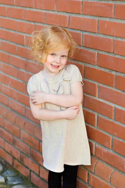 Portrait of a little red-haired girl in city summer — Stock Photo, Image