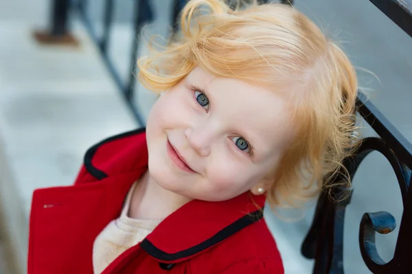 Portrait of a little red-haired girl in city summer — Stock Photo, Image