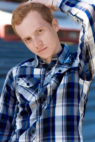 Redhead boy looks at you outdoors in summer — Stock Photo, Image