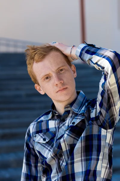 Redhead boy looks at you outdoors in summer — Stock Photo, Image