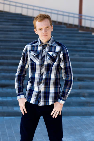 Redhead boy looks at you outdoors in summer — Stock Photo, Image