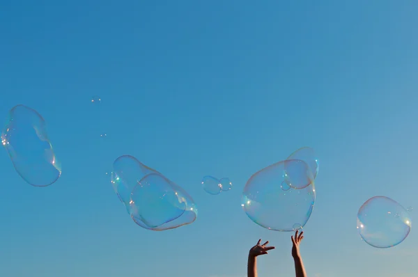 Gigantic soap bubble toy with blue sky background Stock Photo