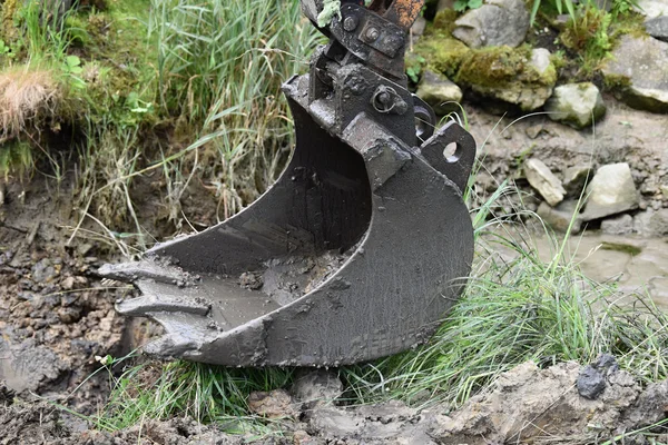 Spoons from small excavators is dirty from mud — Stock Photo, Image