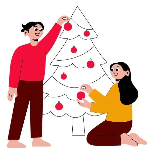 Noel ağacını süslerle süsleyen iki kişi.