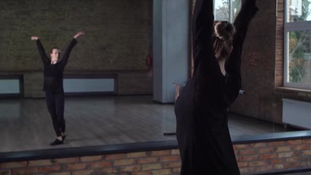 Graceful choreographer honing skills in dance hall — Stock Video