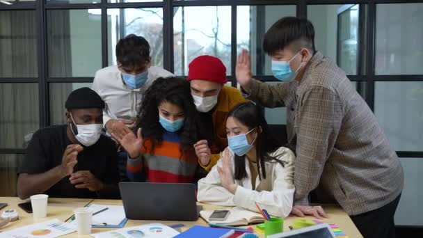 Masked multiracial colleagues during video call — Stock Video