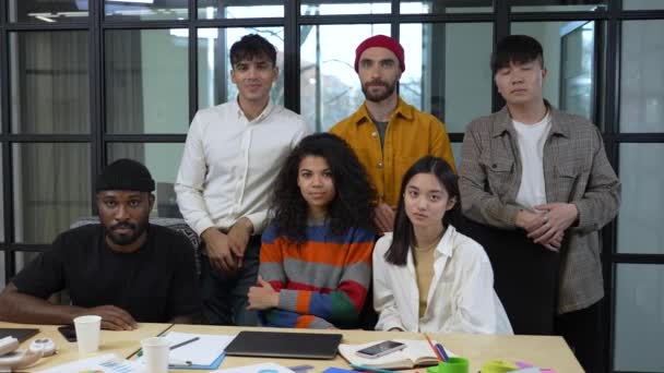 Multi-ethnic coworkers posing for camera in office — Vídeos de Stock