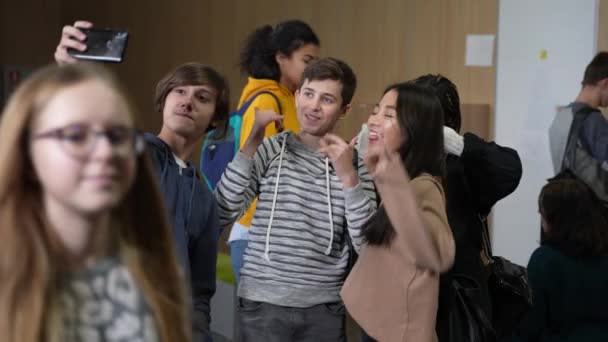 Joyful classmates posing for group photo at school — Stock Video