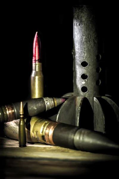 Weapons, cartridge on wooden background — Stock Photo, Image