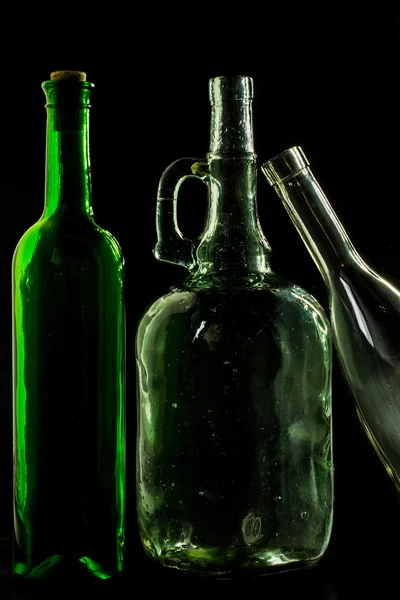 Glass bottle, empty, original, on black background — Stock Photo, Image