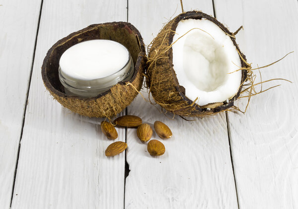 fresh coconut,  cream on a wooden white background