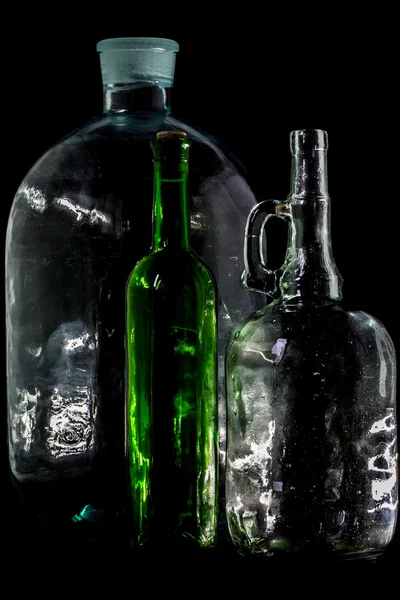 Glass bottle, empty, original, on black background — Stock Photo, Image