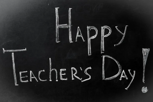 chalk inscription, happy teacher's day on black Board