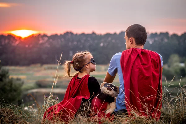 Little girl with dad dressed in super heroes, happy loving family — Stock Photo, Image