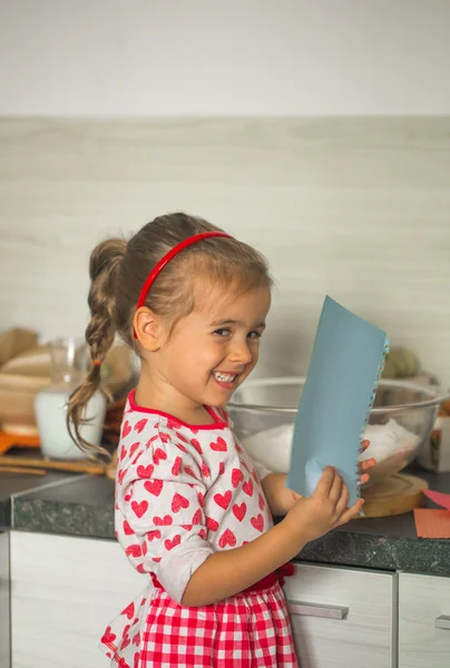 Beautiful little girl Baker on kitchen — Stock Photo, Image