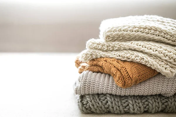 Stack Warm Knitted Items Blurred White Background Copy Space — Stock Photo, Image