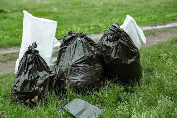 Close up of trash bags filled with trash after cleaning the environment.