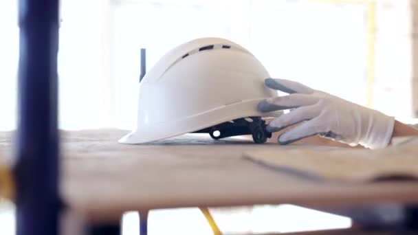 Construction Worker Putting His Safety Gear Helmet Job Site Builder — Stock Video