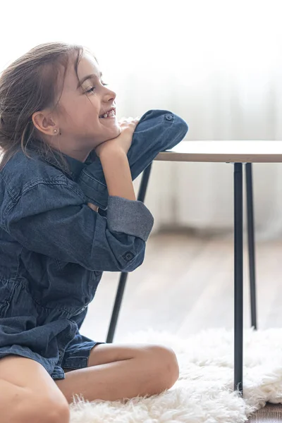 Little Girl Interior Room Pensively Looks Distance Sitting Floor — Stock Photo, Image