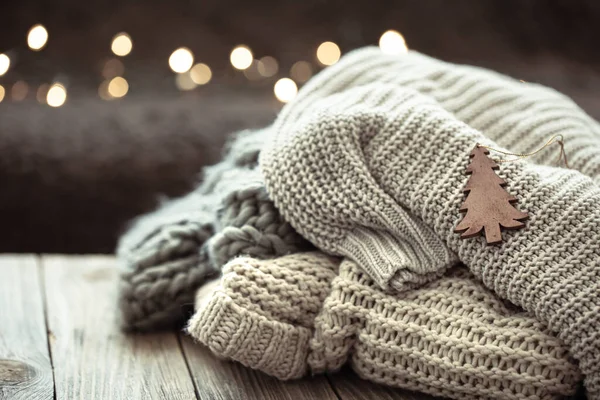 Cozy Christmas Composition Stack Knitted Sweaters Blurred Background Bokeh — Stock Photo, Image
