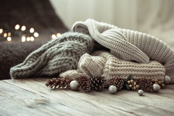 Cozy Christmas Composition Stack Knitted Sweaters Decorative Pine Cones Blurred — Stock Photo, Image