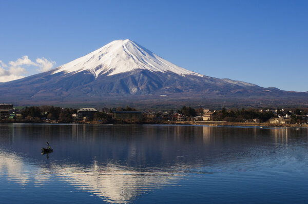 Mt Fuji view from the lake with a boat and reflection