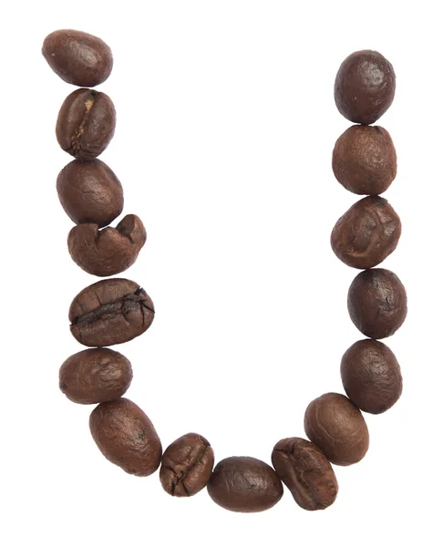 Isolerade alfabetet; U gör från kaffebönor på vit bakgrund — Stockfoto