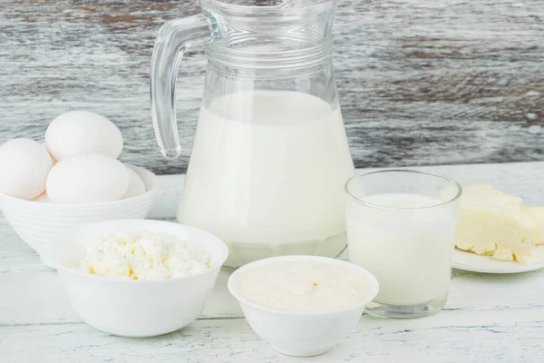 Different Dairy Products White Wooden Boards Blurred Background — Stock Photo, Image