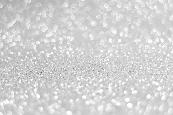 Small gray glitter background and white blur bokeh bright light — Stock Photo, Image