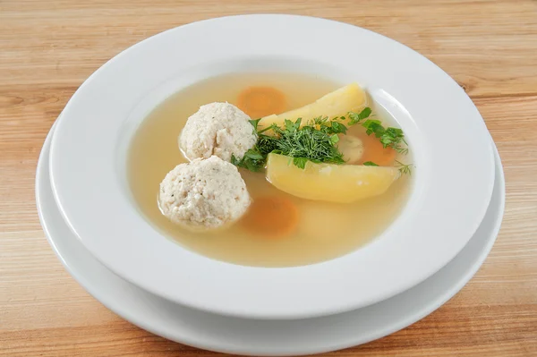 Soup with meatballs in a bowl, sprinkle with herbs — Stock Photo, Image