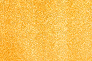 Sıcak altın tonlarda bulanık bir arkaplan. Tatil temaları, kış kutlamaları, Noel ve Yeni Yıl kutlamaları için ideal.