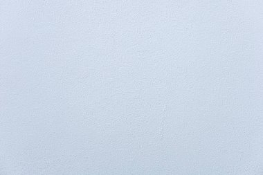 Düz, açık gri bir arka plan ve pürüzsüz bir dokusu var. Yüzey yumuşak ve düzenli görünüyor, çeşitli tasarım uygulamaları için uygun.