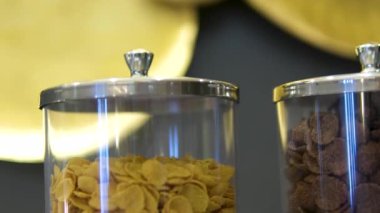 Cereal dispensers breakfast cereals snacks for light and healthy breakfast in hotel breakfast area. High quality 4k footage