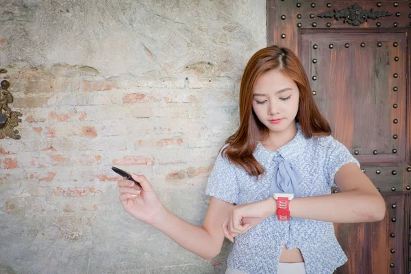 The Woman with smart watch.With space for text ads. On the tip o