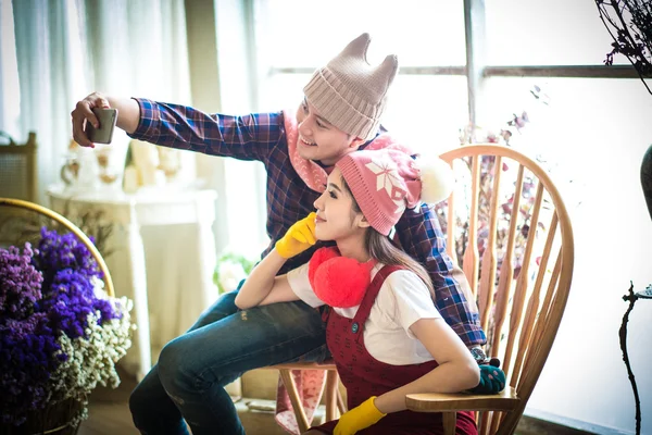 Family with little girl in park taking selfie by mobile phone. — Stock Photo, Image