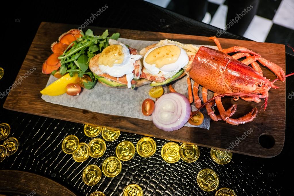 The Half Live Maine Lobster Benedict with Champagne Vinegar Holl
