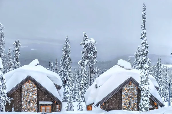 Cozy vacation cabins covered with fresh snow. Big White Ski resort. Kelowna. British Columbia. Canada