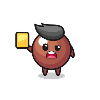 Futbol hakemi olarak çikolata topu karakteri sarı kart veriyor, tişört, çıkartma, logo elementi için şirin bir tasarım.