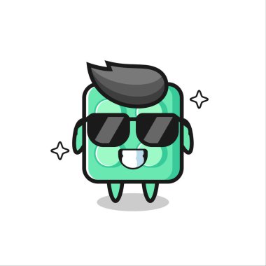 Tuğla oyuncağın karikatür maskotu havalı jestler, tişört, çıkartma, logo elementi için şirin bir tasarım.